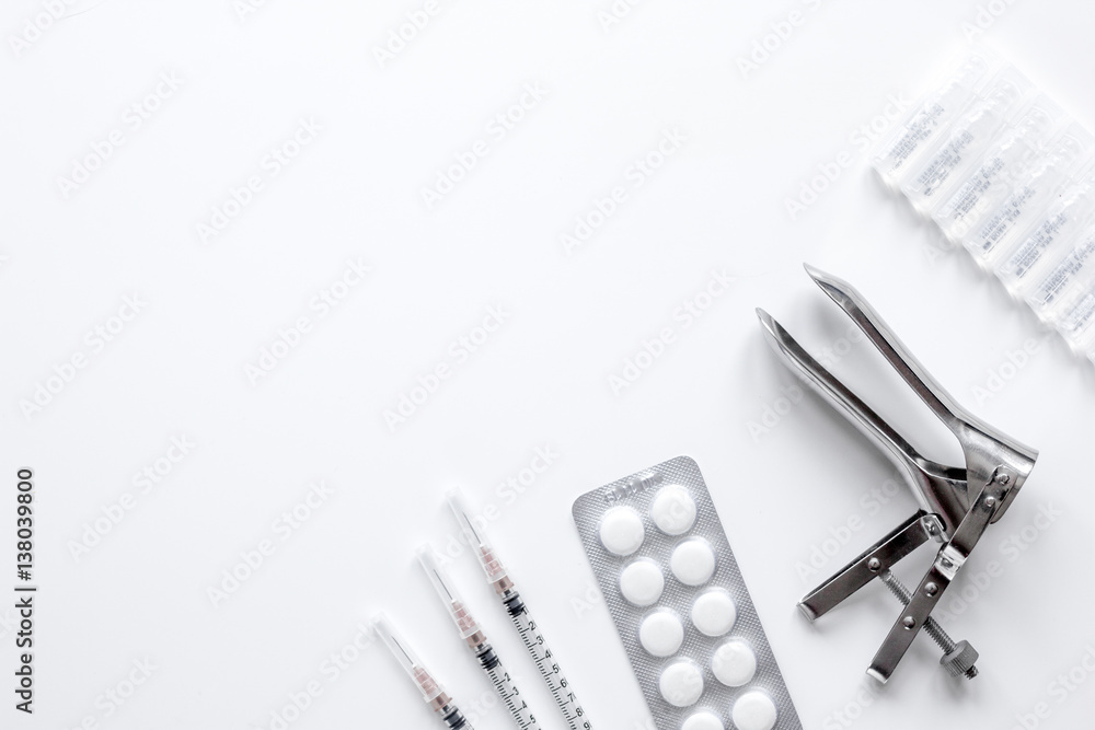 instruments of gynecologist on white background top view mock up