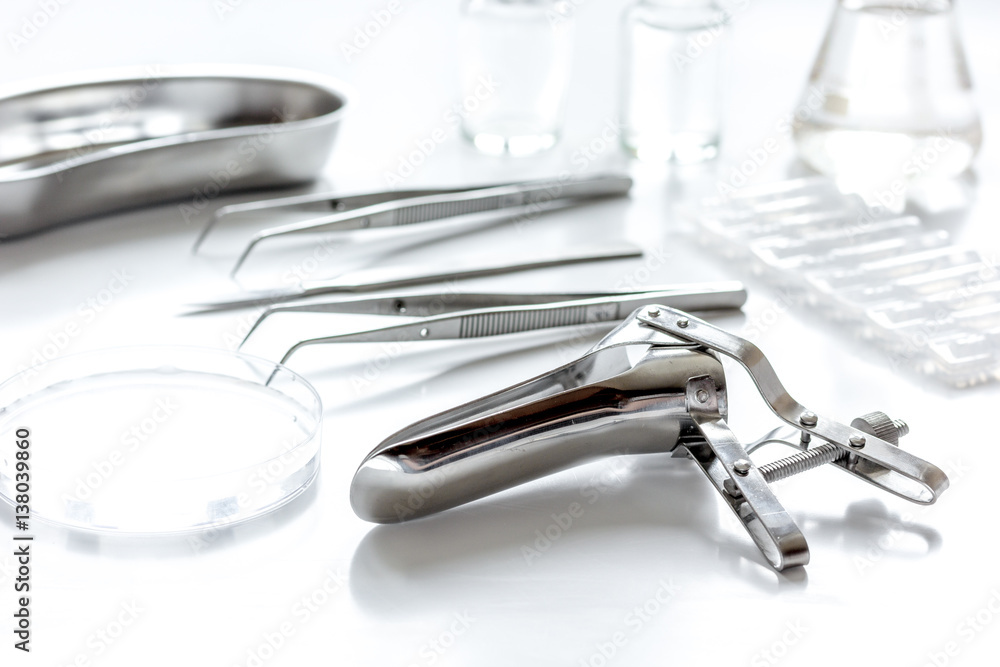 instruments of gynecologist on white background