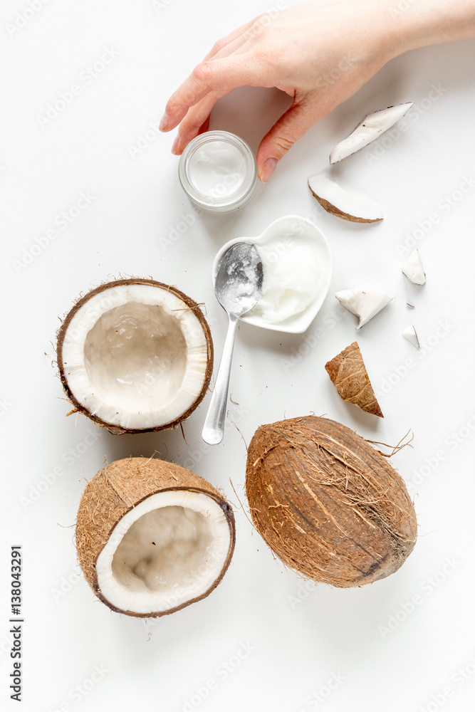 organic cosmetics with coconut on white background top view