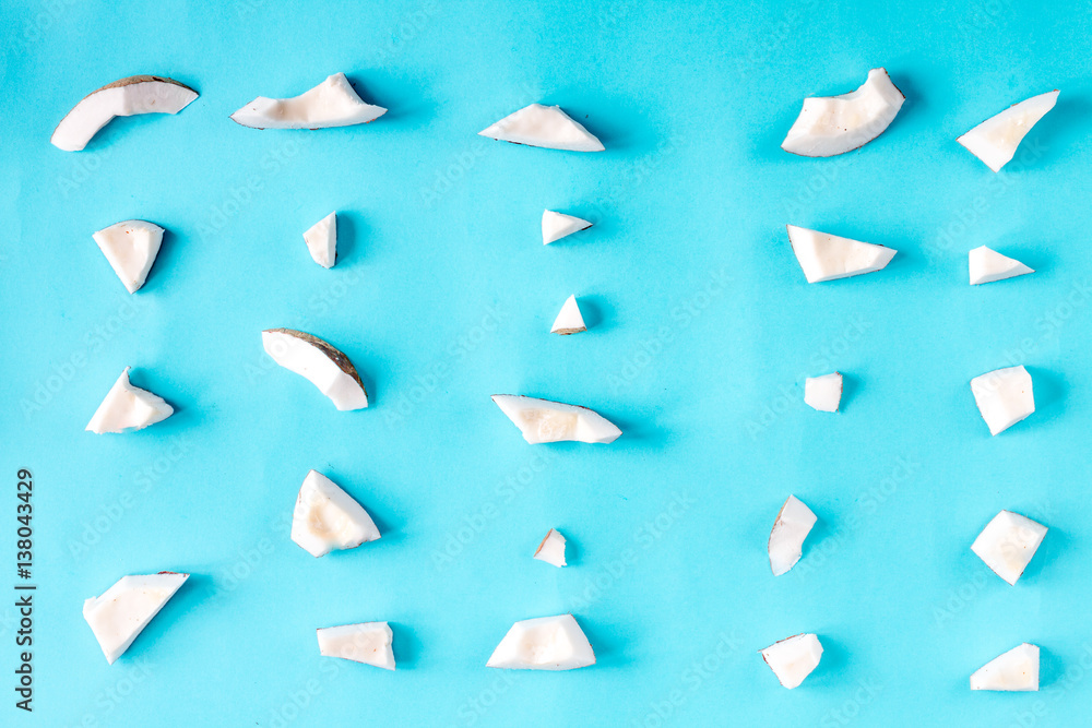 concept organic cosmetics with coconut on blue background top view