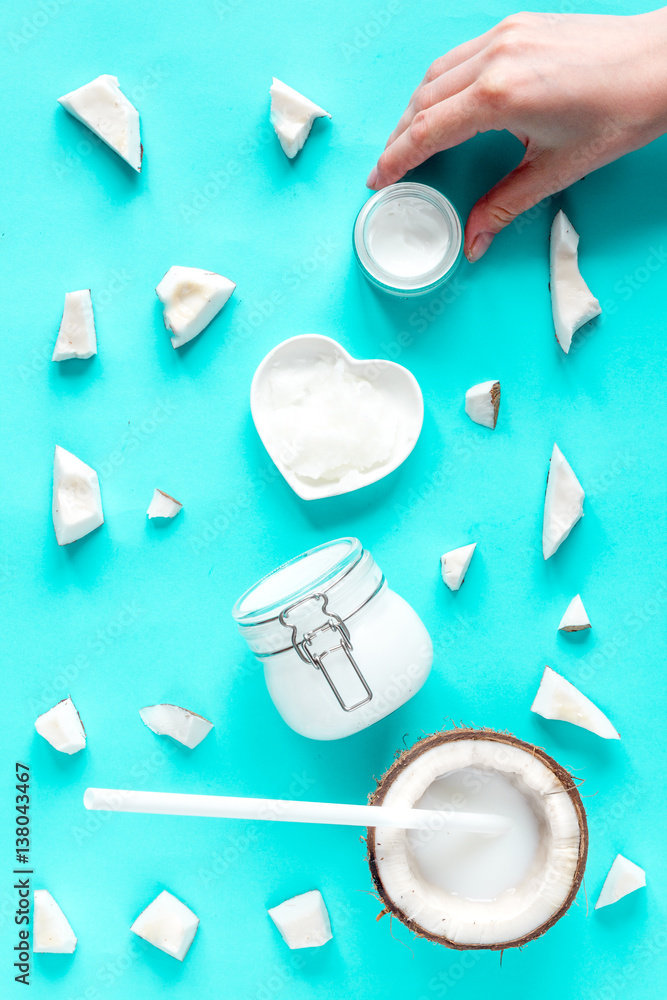 concept organic cosmetics with coconut on blue background top view