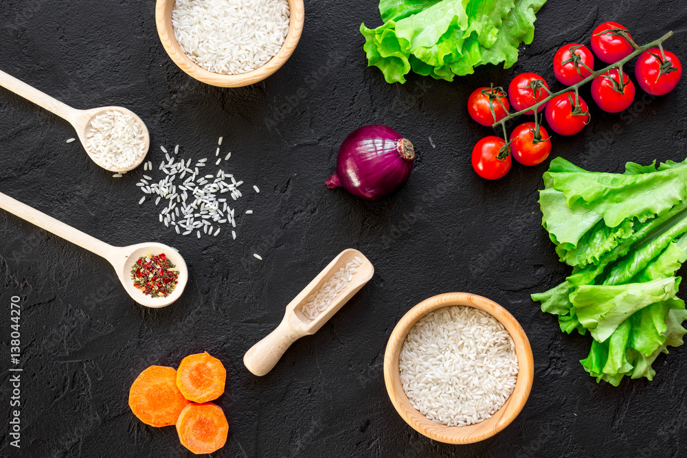 ingredients for paella on dark background top view