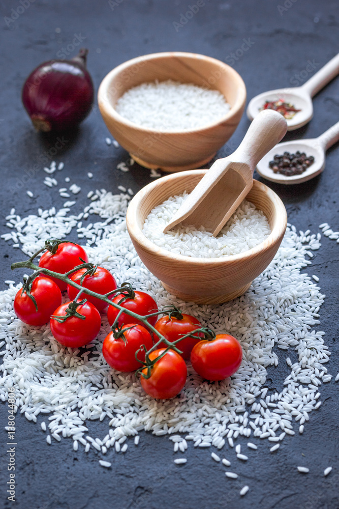 ingredients for paella on dark background