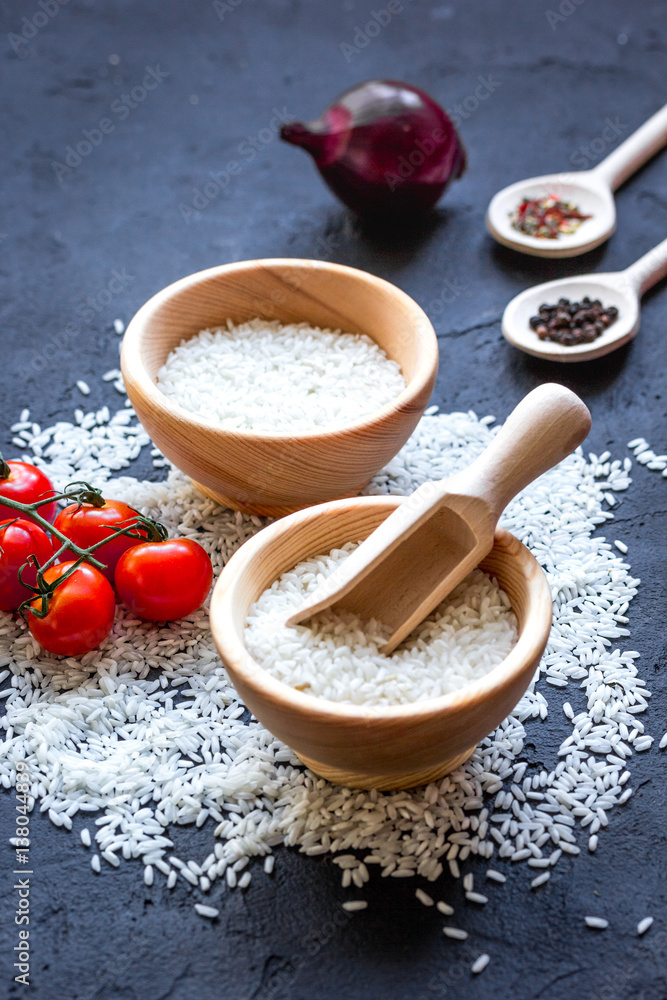 ingredients for paella on dark background