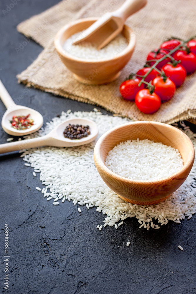 ingredients for paella on dark background