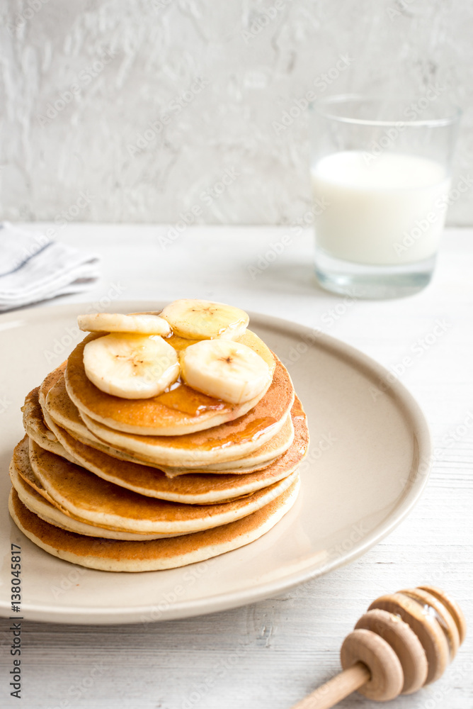 cooked pancake on plate at wooden background