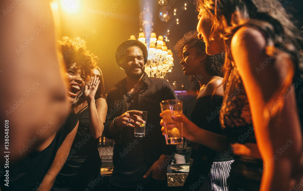 Group of friends enjoying a party at pub