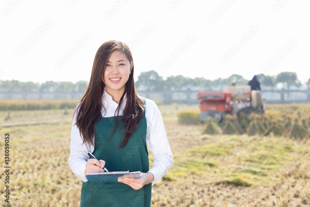 pretty asian woman in golden cereal field