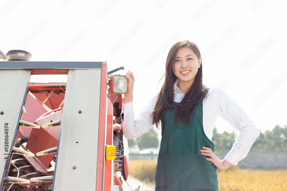 young asian woman agronomist in golden field