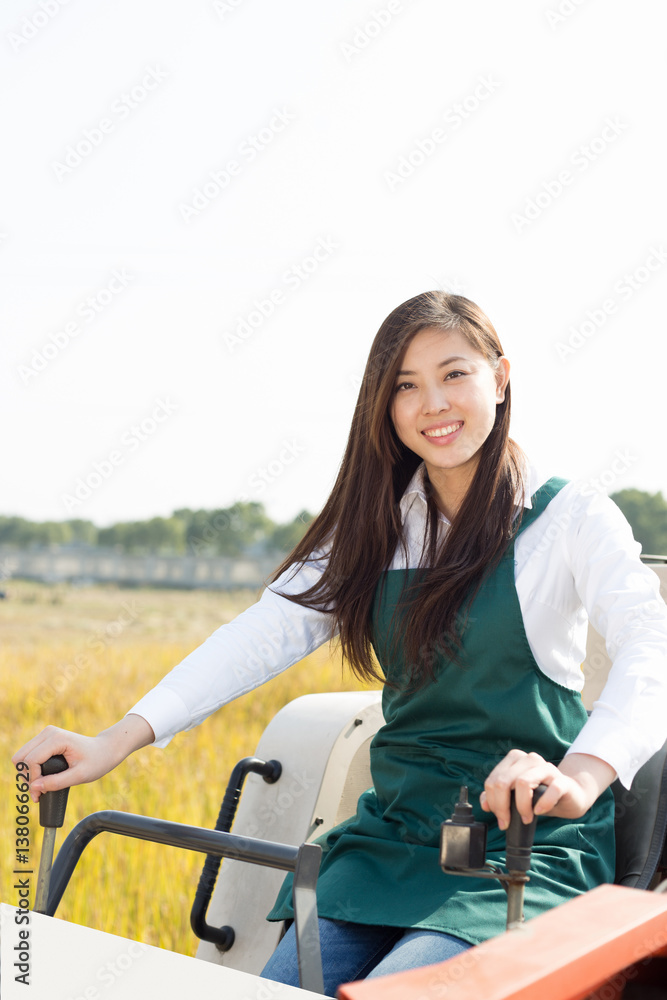 young asian woman agronomist in golden field