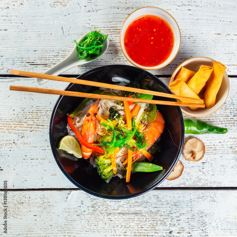 Asian prawns with rice noodles and spring rools