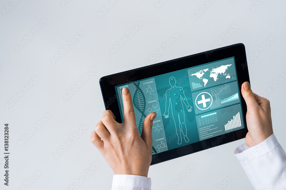 Close of female doctor hands working with tablet pc computer