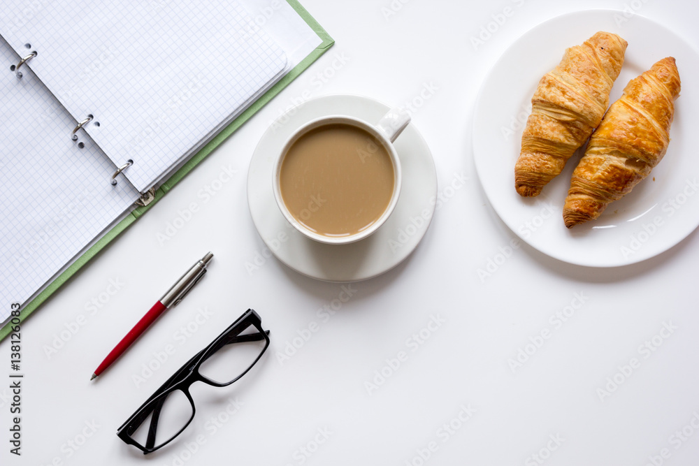 Business lunch with croissant on white table top view