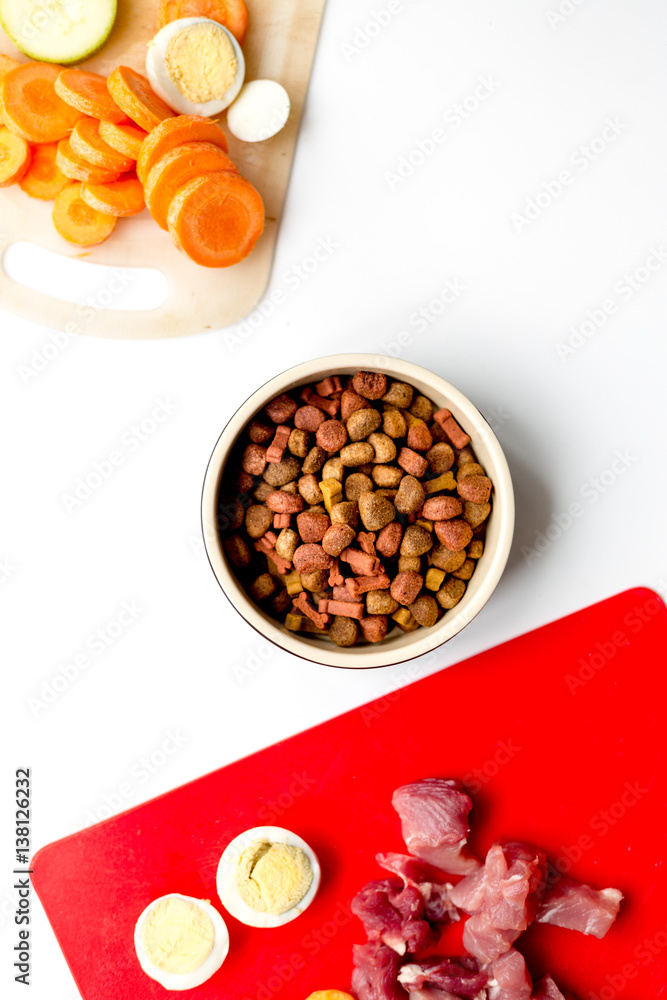 Set of animal food, meat,vegetables and eggs on kitchen top view