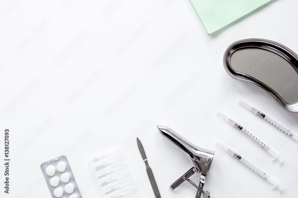 instruments of gynecologist on white background top view mock up