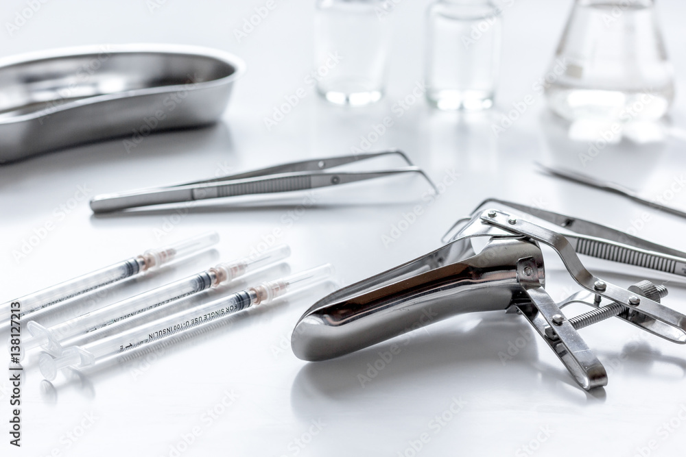 instruments of gynecologist on white background