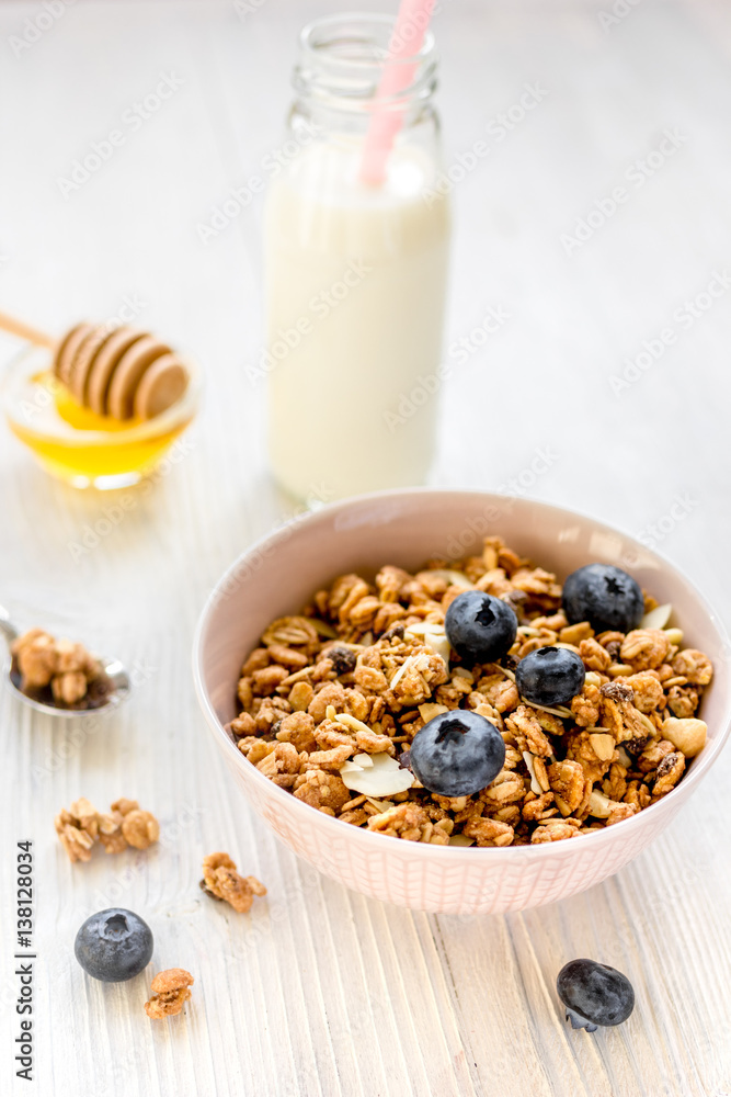 Healthy morning with granola breakfast on white kitchen table