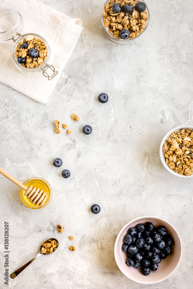 Oat flakes with honey and berries on table background top view