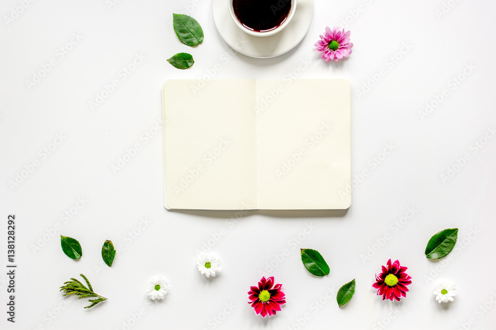 Copybook, americano and flowers on white table top view mock-up