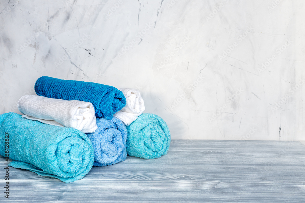 Towels pile in housekeeping set on laudry background mockup