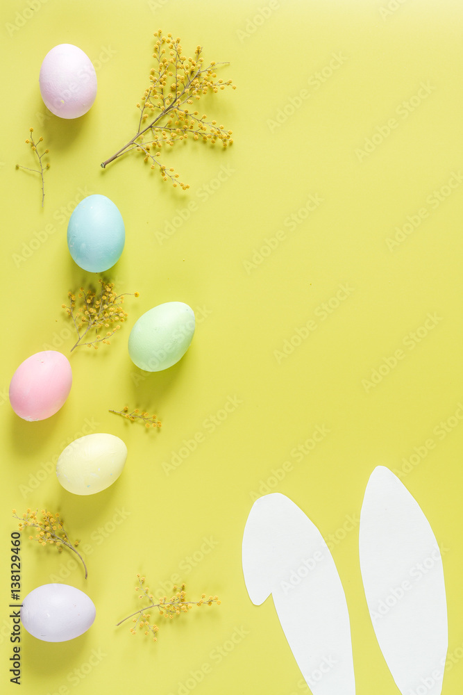 Easter concept on yellow background top view mockup