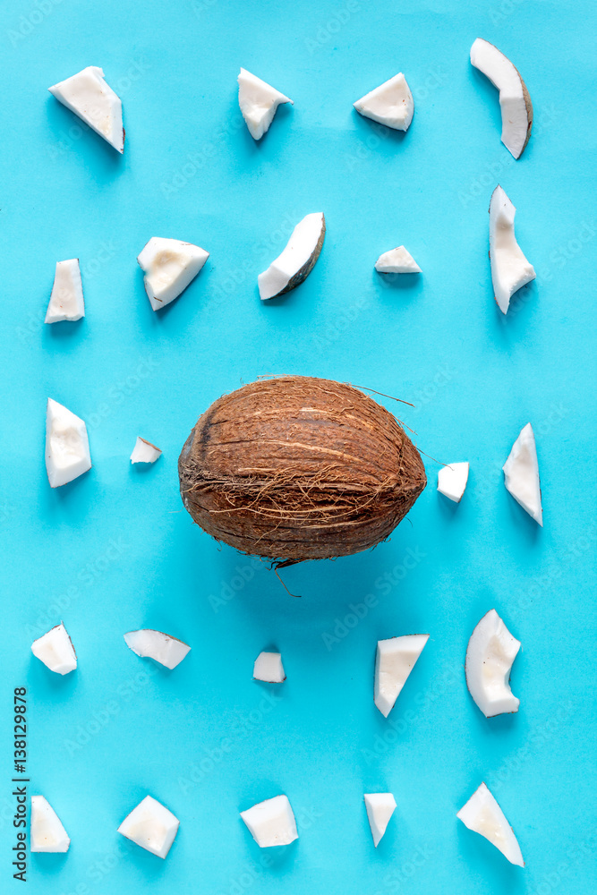 concept organic cosmetics with coconut on blue background top view