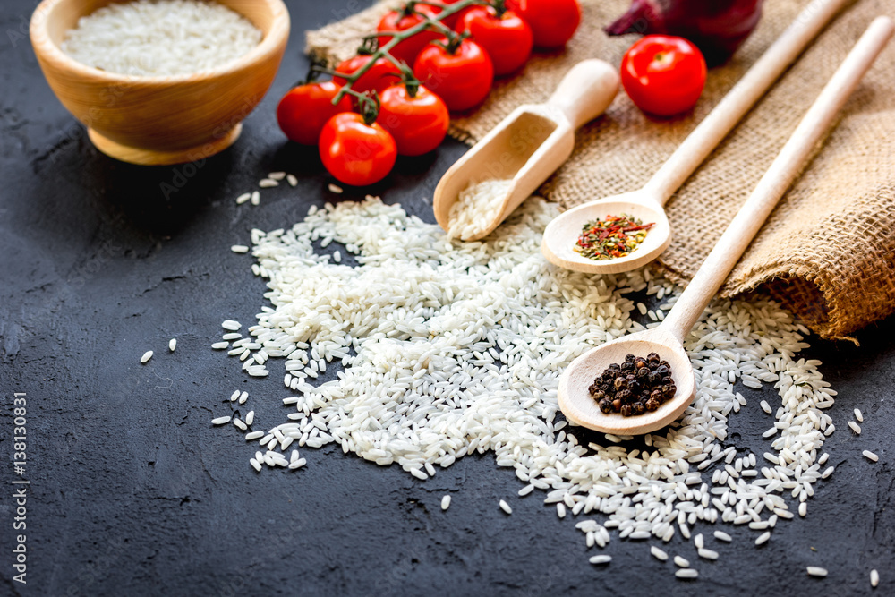 ingredients for paella on dark background