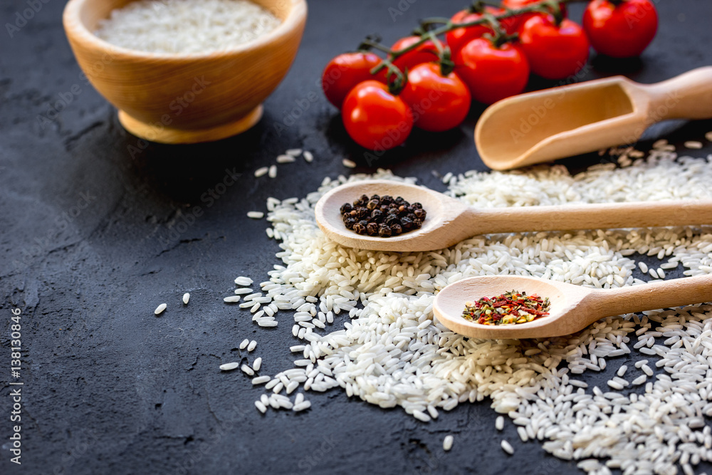 ingredients for paella on dark background