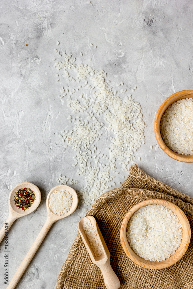 rice for paella on stone background top view mock up