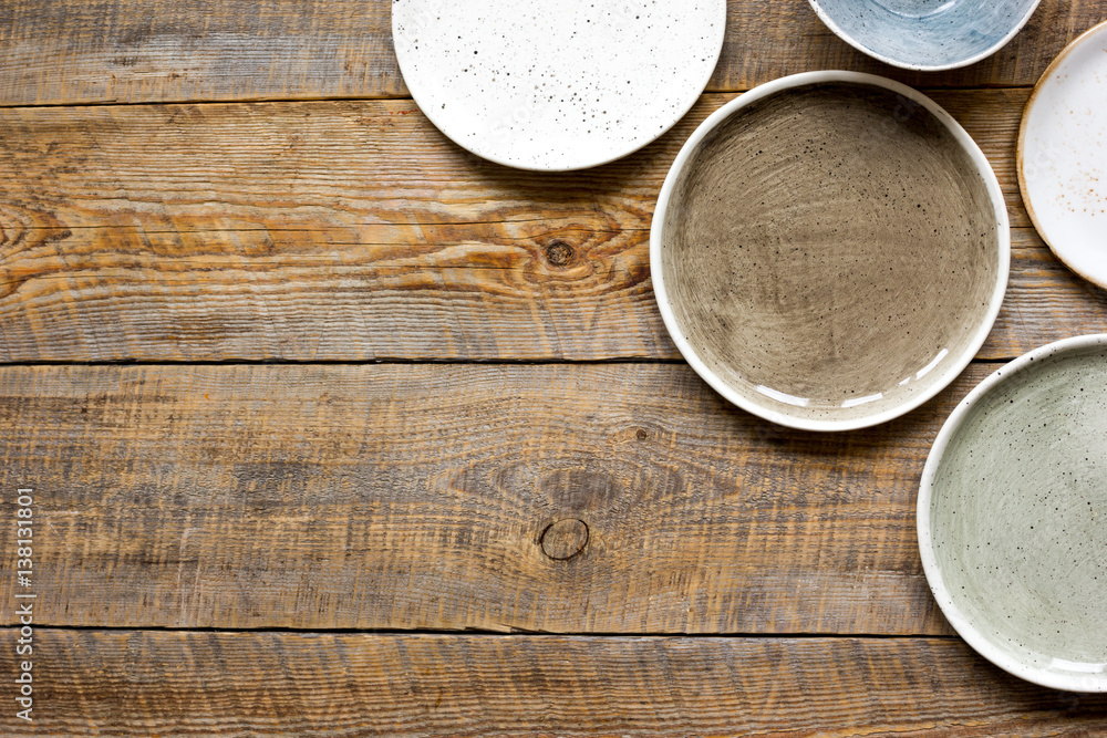 ceramic tableware top view on wooden background mock up