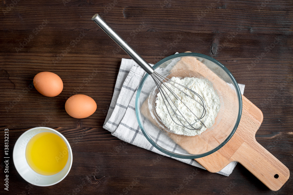 cooking pancake on wooden background top view ingredients for making