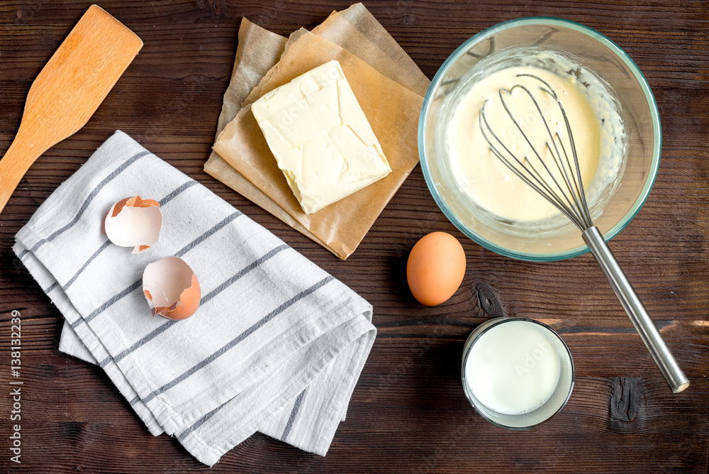 cooking pancake on wooden background top view ingredients for making