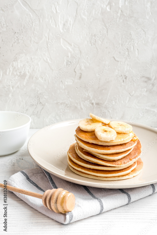 cooked pancake on plate at wooden background