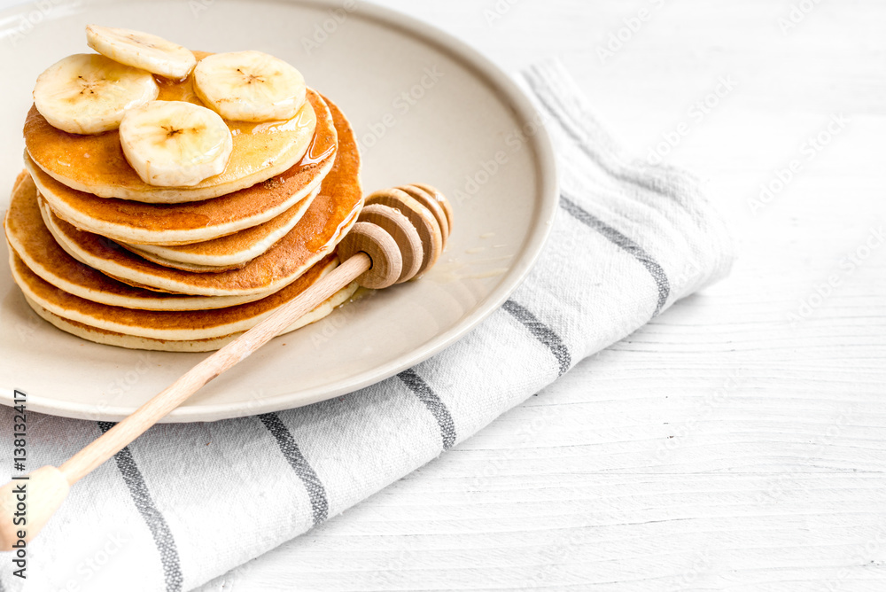 cooked pancake on plate at wooden background