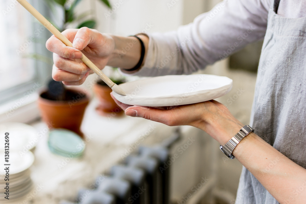 workshop production of ceramic tableware product painting