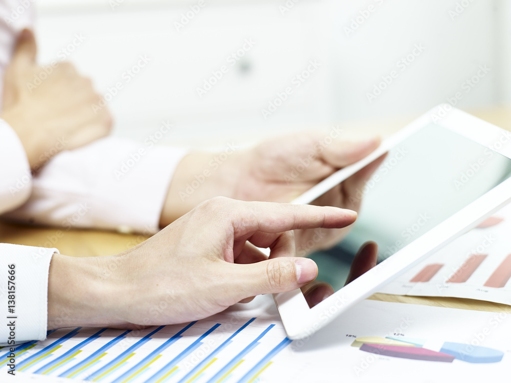 two corporate people discussing business in office