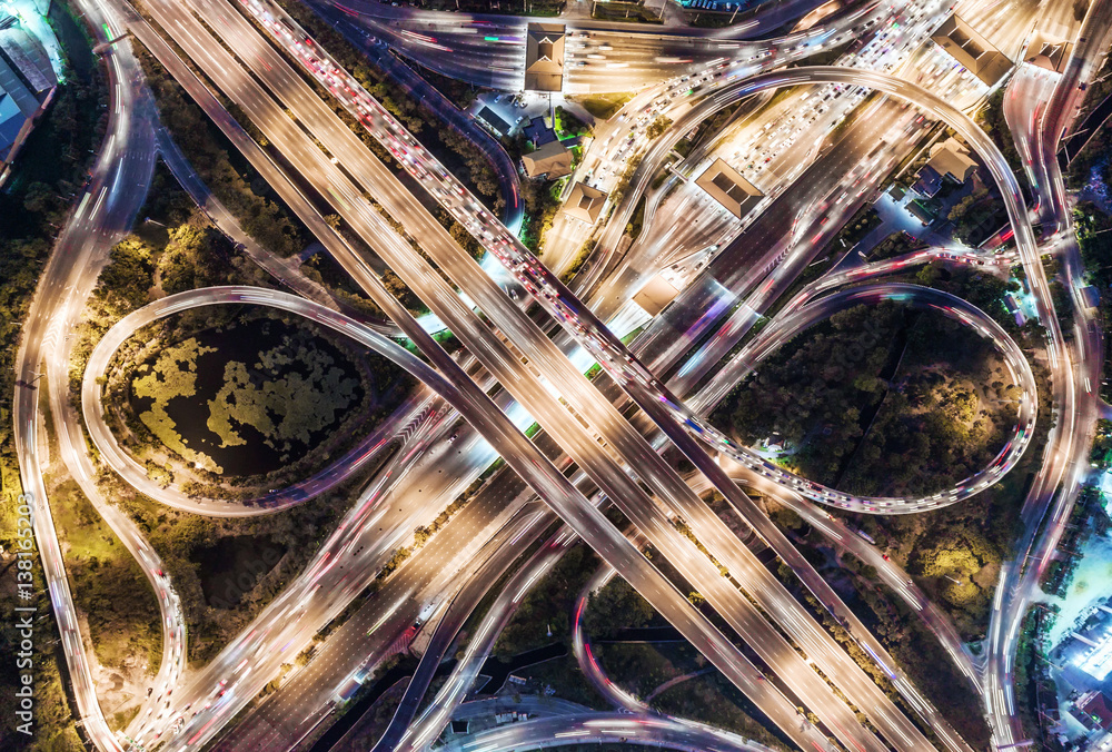 The light on the road  roundabout at night and the city in Bangkok, Thailand. Aerial view, Top view.