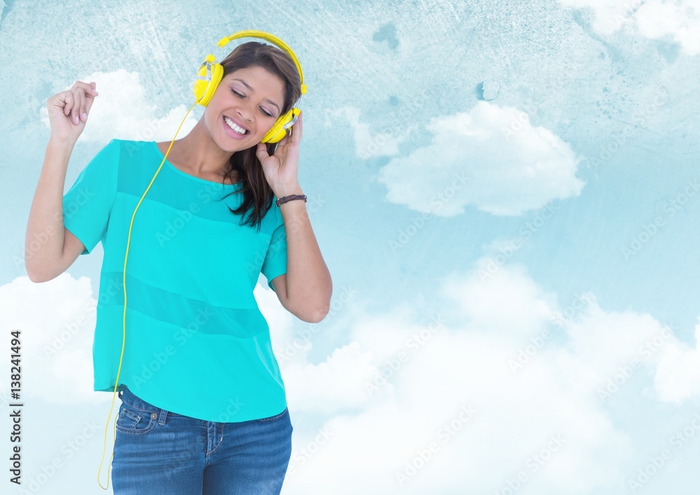 Woman with headphones against sky against a blue background