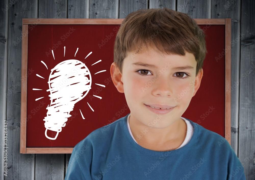 kid and blackboard with lightbulb against a wood background