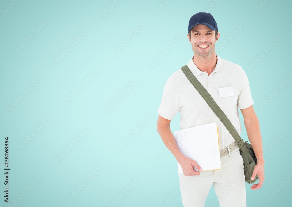 Smiling man looking at camera against a light blue background