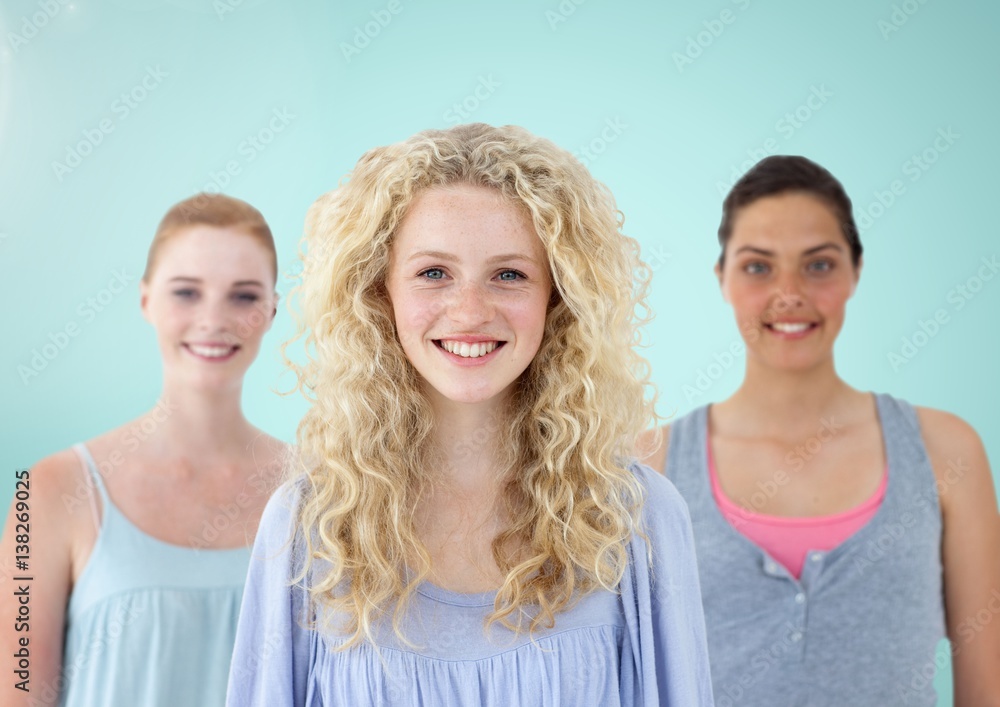 Girls Portrait smiling at camera against a light blue background