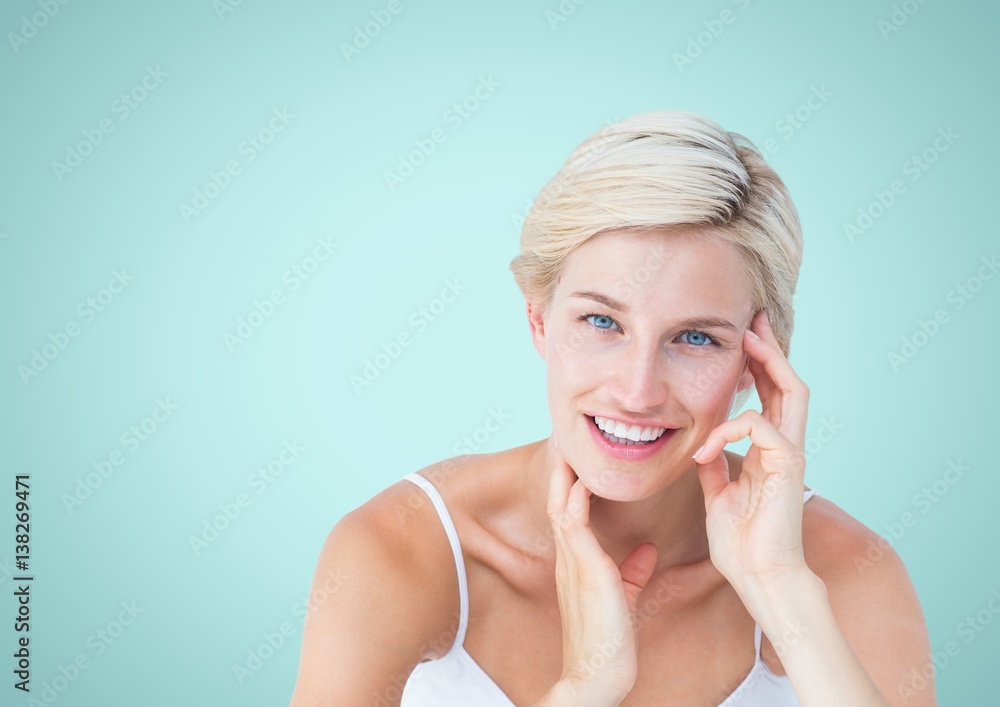 Happy Woman Smiling againsr a light blue Background