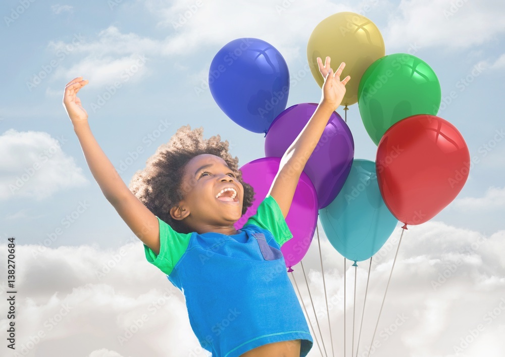 Kid with Balloons has Happy Fun against a cloudy background 