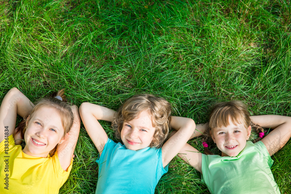 Group of happy children playing outdoors