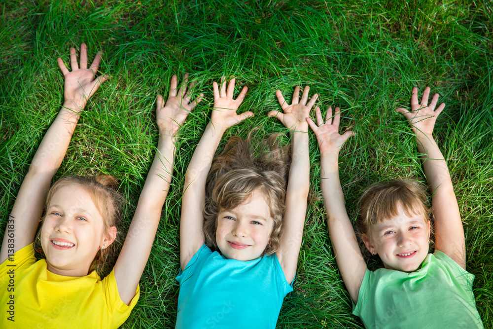 Group of happy children playing outdoors