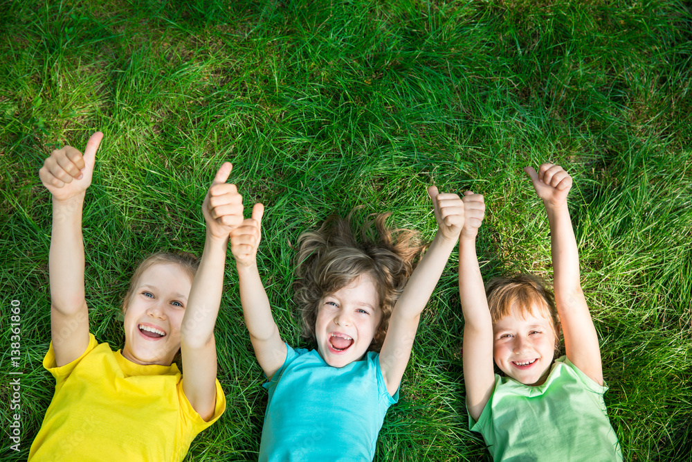 Group of happy children playing outdoors