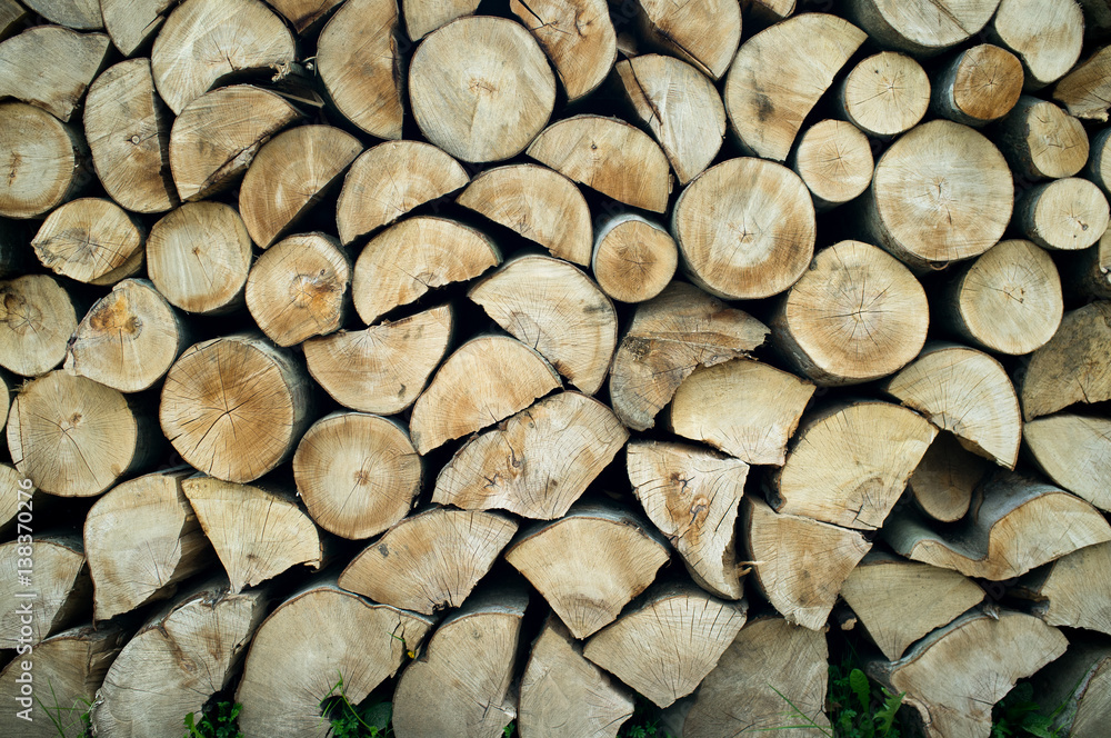 Natural wooden background, closeup of chopped firewood.