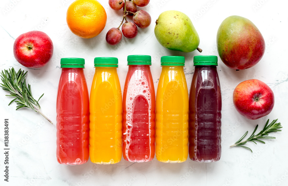 fitness drink in plastic bottle on white table background top view