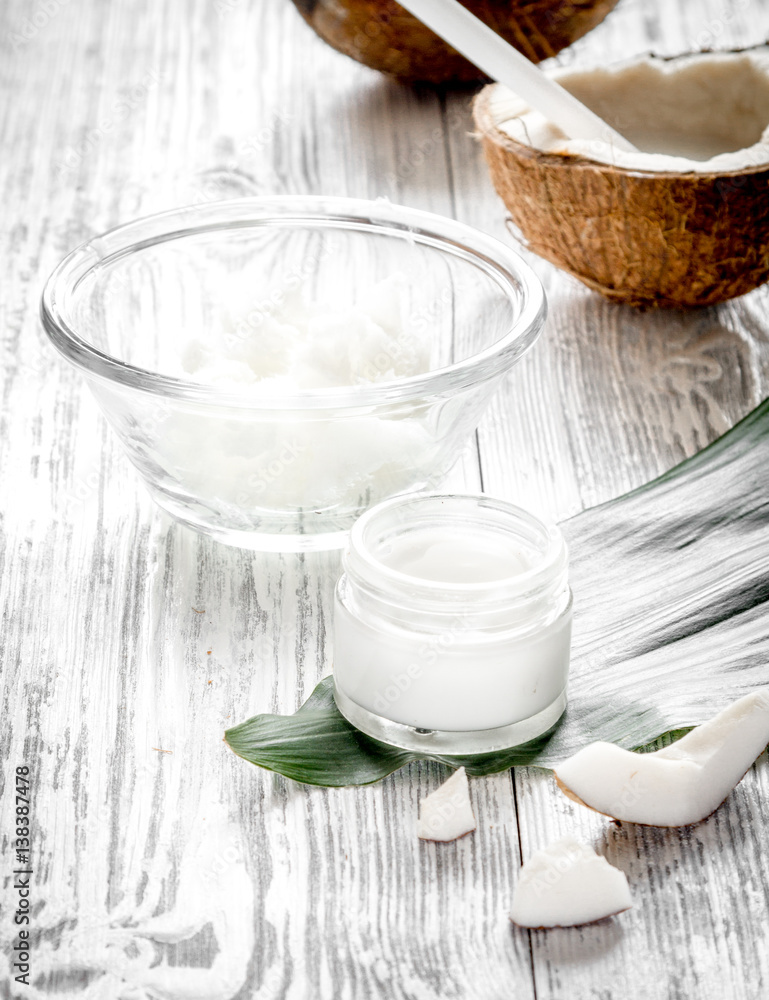 organic cosmetics with coconut on wooden background close up