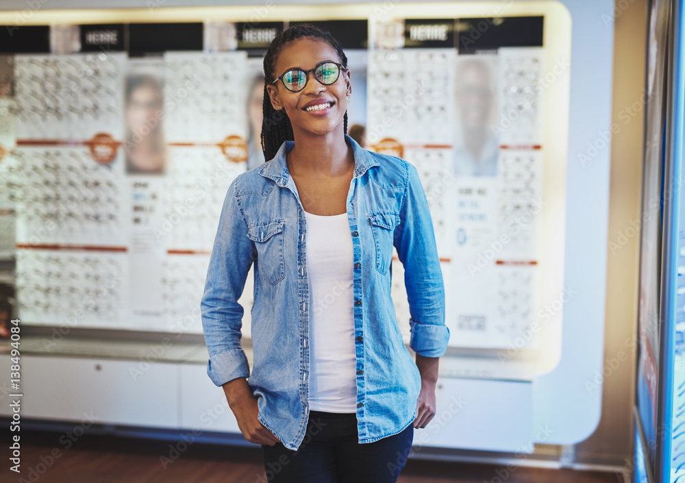 Pretty woman in eyeglasses at eye wear store